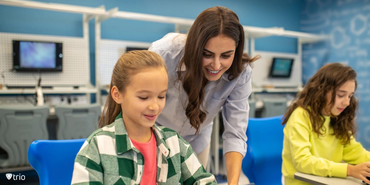 Teacher monitoring student’s computer use