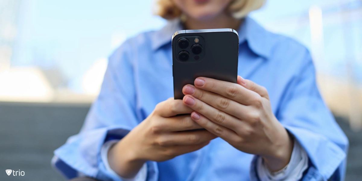 Woman using iPhone for MAC Address Randomization