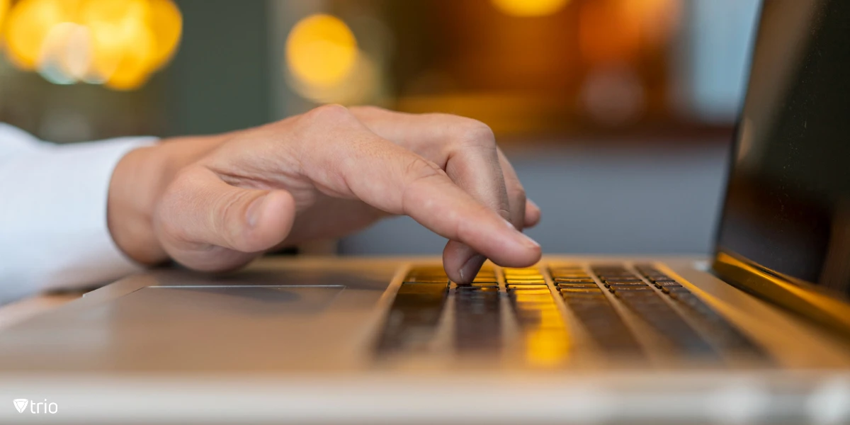 Man typing on laptop