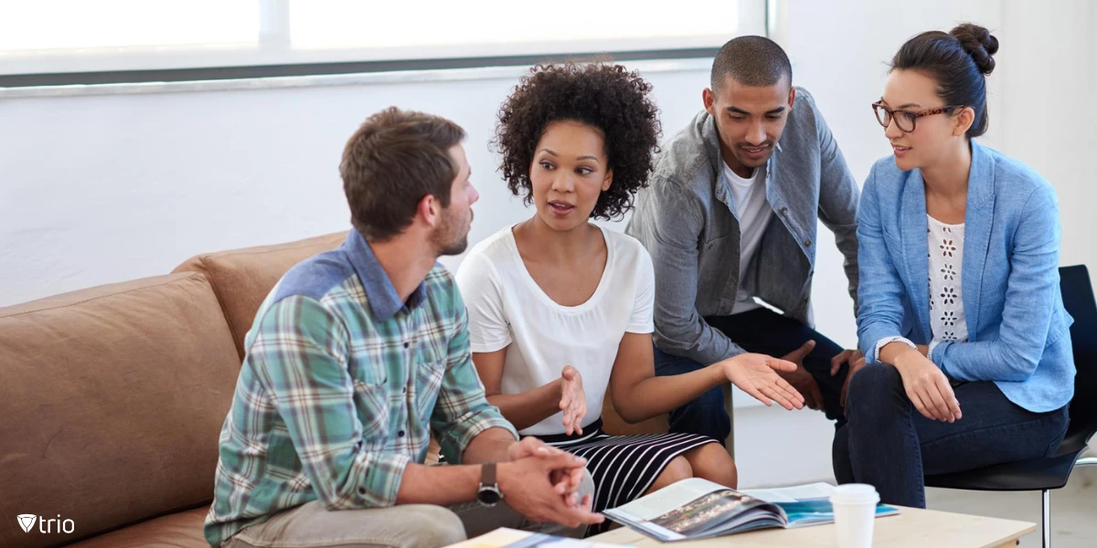 A team meeting in the office to discuss which framework to follow.