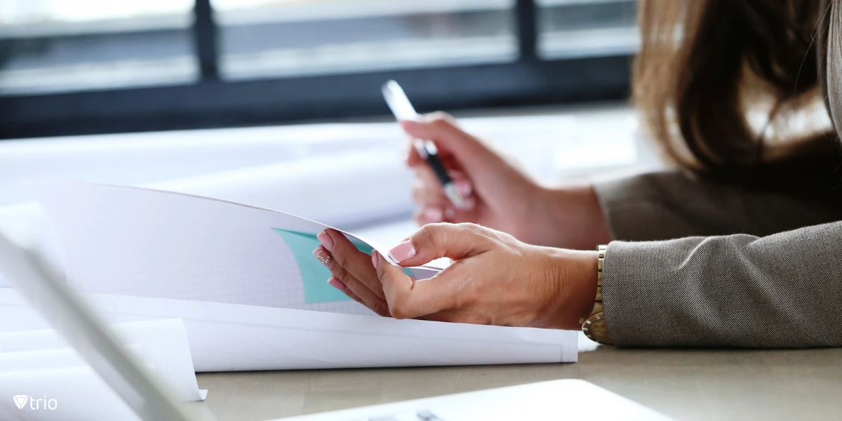 An auditor writing her evaluation.