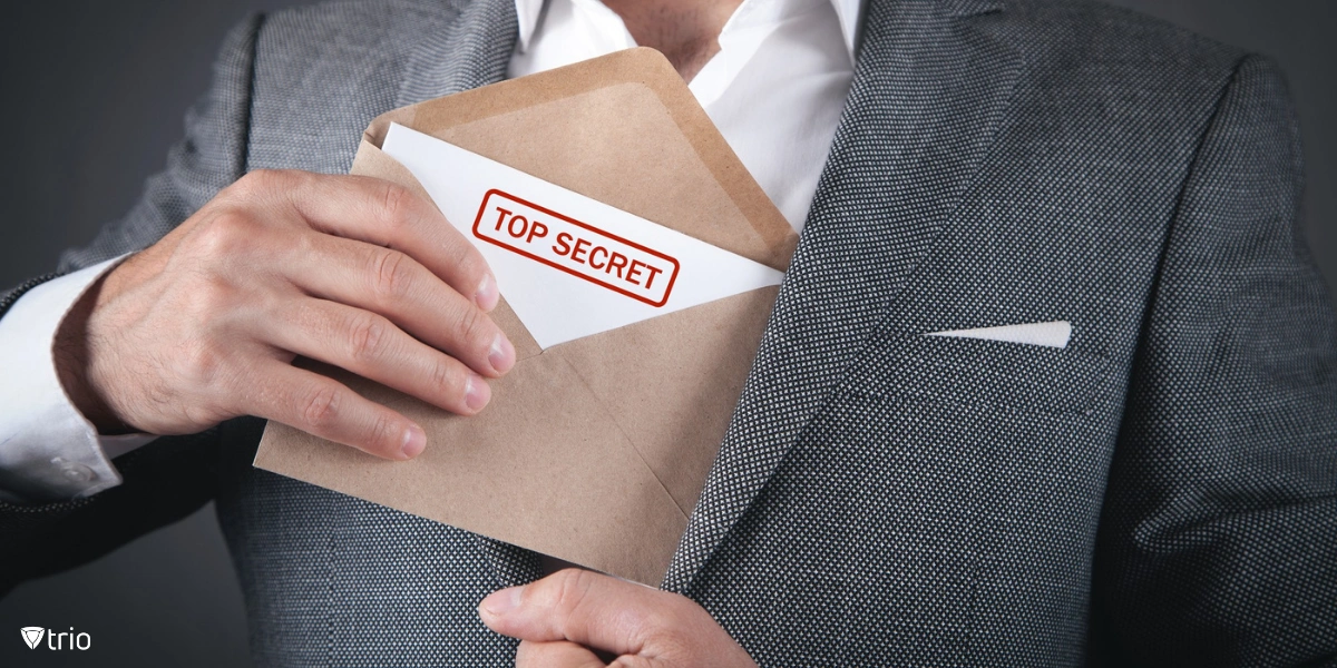 A man holding an envelope labeled "Top Secret," suggesting the act of stealing confidential information.