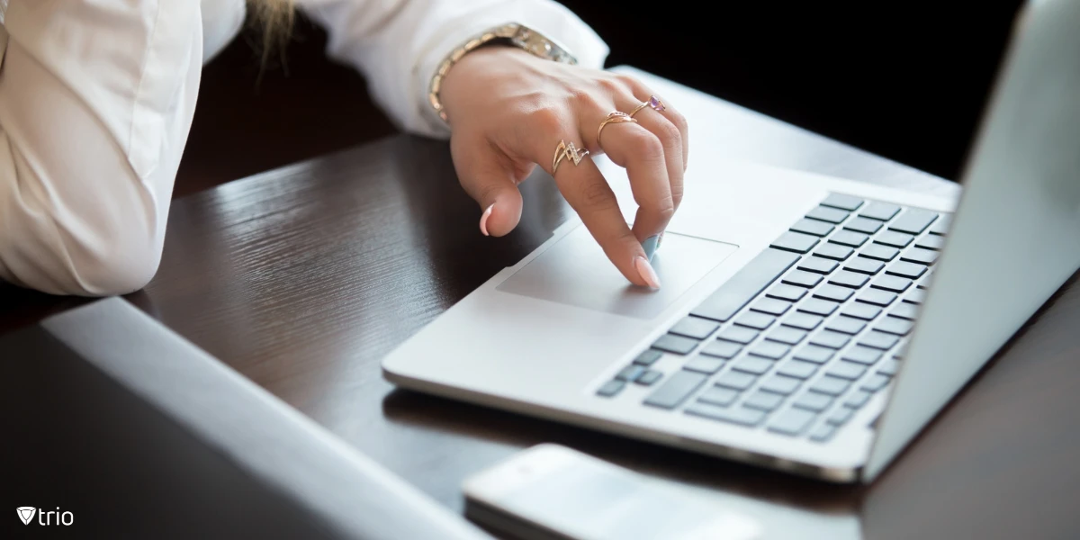 Woman using electronic signature on laptop