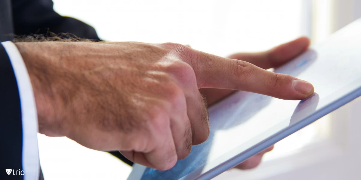 Corporate-suited man using an electronic signature