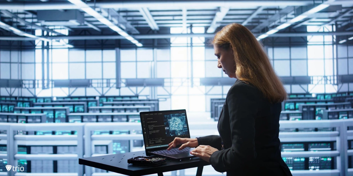 Admin in data center working with a laptop