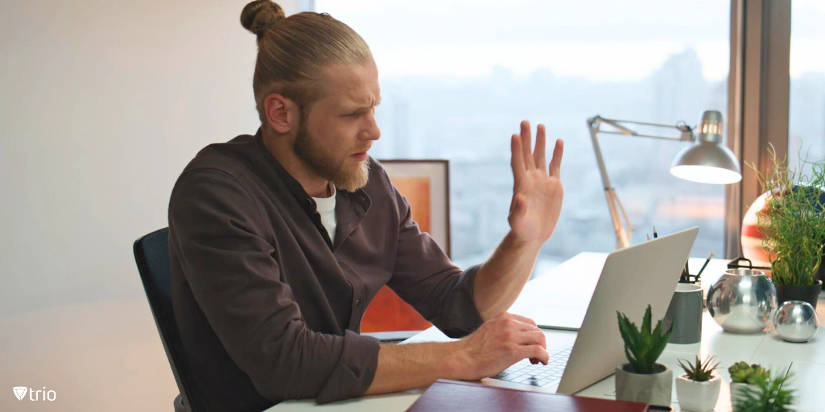 man using zero-touch automation capabilities in his home office on his laptop