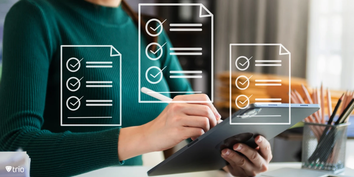 businesswoman working on a tablet with pen with three virtual checklists coming out of the screen