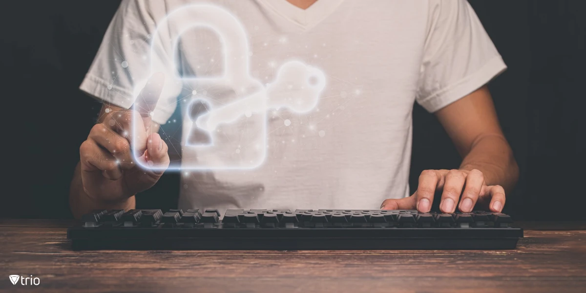 Man using a keyboard with concept art of a key in a lock