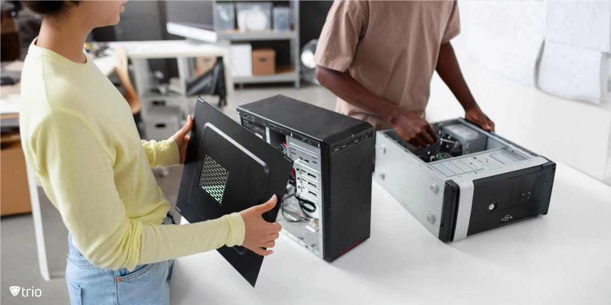 Individuals assembling or repairing desktop-style computer towers for traditional file servers that require manual setup and maintenance, often handled by IT personnel