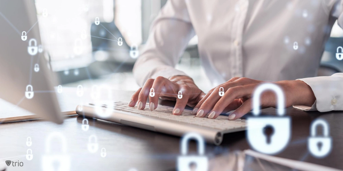 woman typing on keyboard in front of pc with virtual lock icons filling the frame