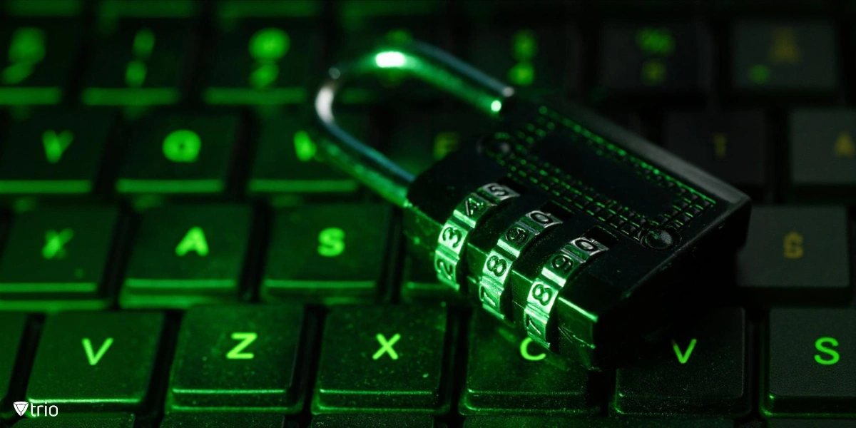 A close-up of a combination padlock resting on a computer keyboard.