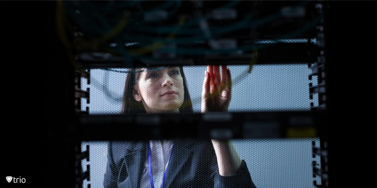 woman looking at the data server and checking it