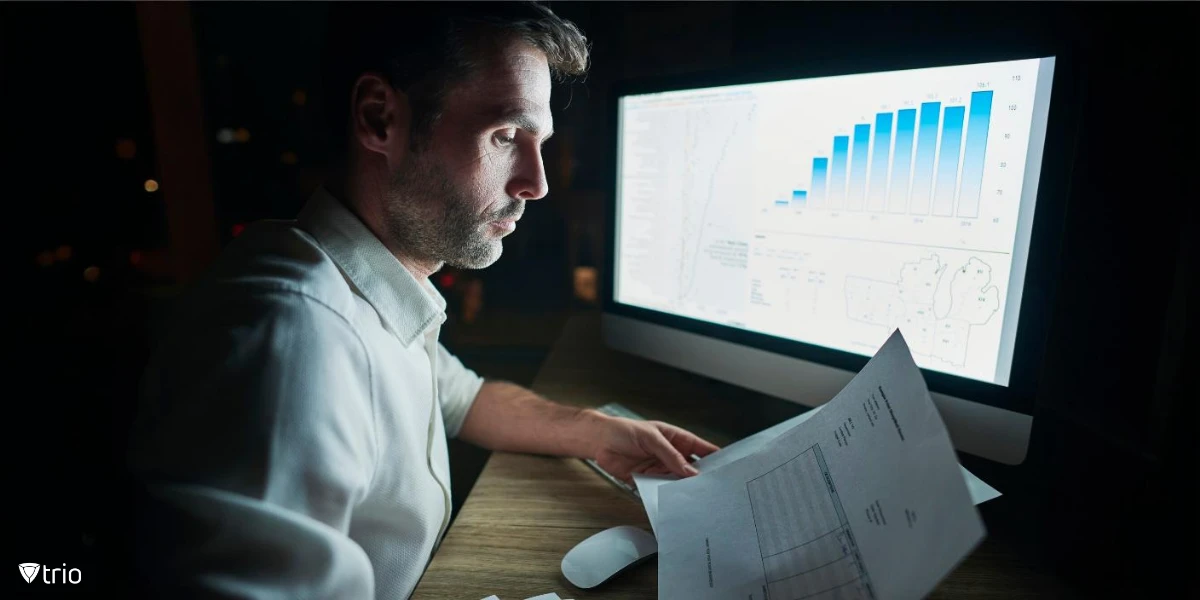 Man analyzing documents at night