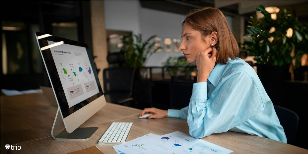 Woman analyzing graphs on computer