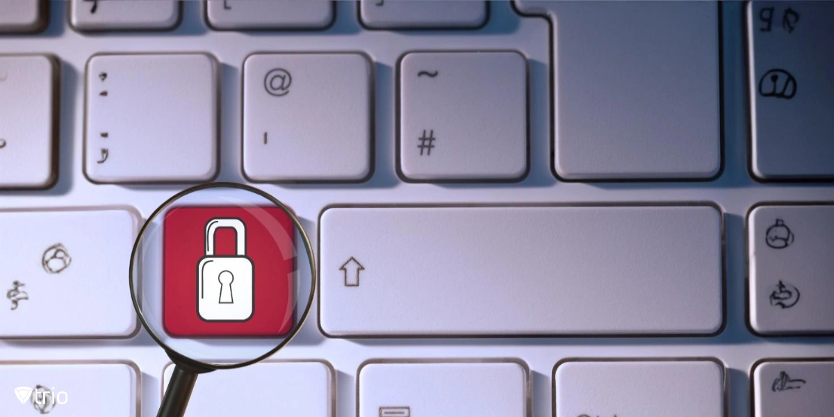 A close-up of a keyboard with a magnifying glass highlighting a red key with a padlock symbol